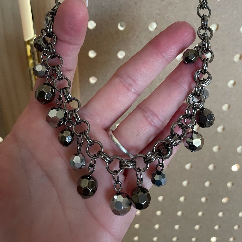 Mid length gunmetal necklace with gunmetal and silver beads.